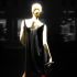 Woman in black dress and red boots